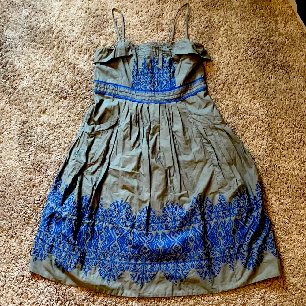 Gorgeous grey, embroidered sundress with removable straps and pockets.